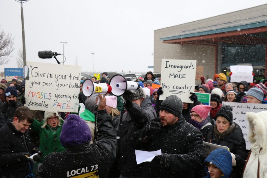 Protesters gather outside Willard Airport on Sunday to march against Trumps recent executive order on immigration.