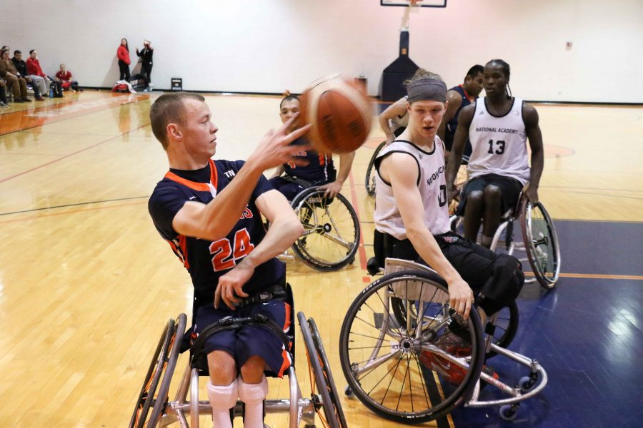 Illinois Spencer Heslop passes the ball in the tournament against Canadian Academy on Saturday at the ARC.