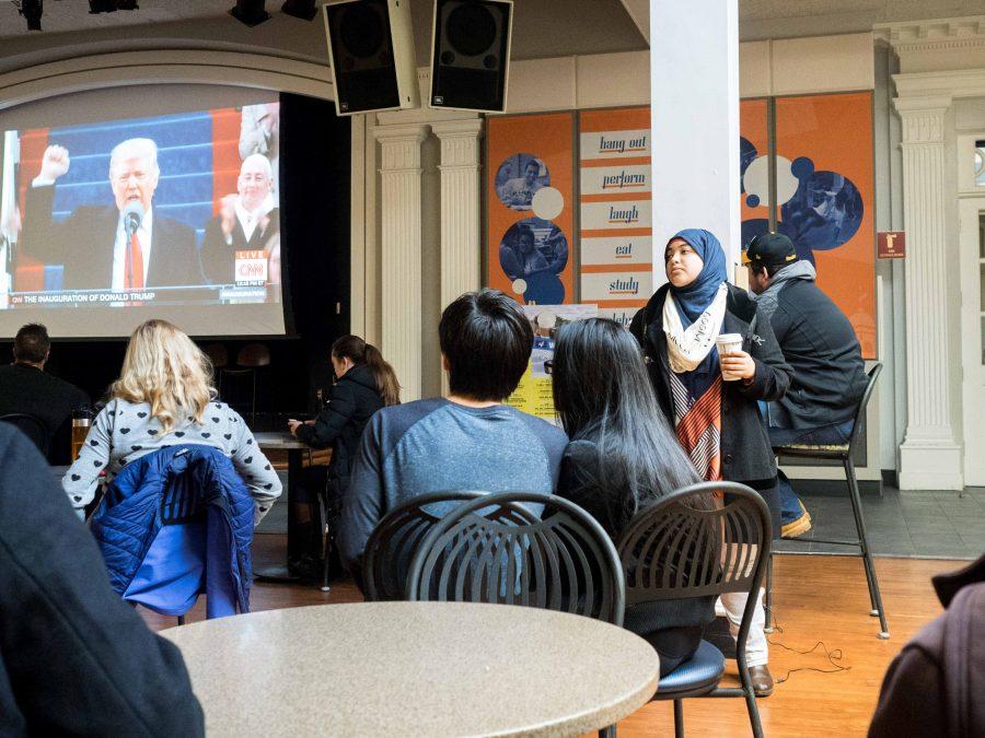 Students sit in the Illini Union on Friday to watch Donald Trump, the 45th President of the United States, be inaugurated. Trump’s inauguration brought about a wide array of reactions from students.