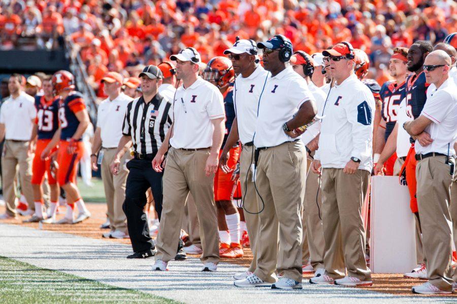 Illinois head coach Lovie Smith (front) watches his team from the sidelines during the game against Murray State at Memorial Stadium on Saturday, September 3. 