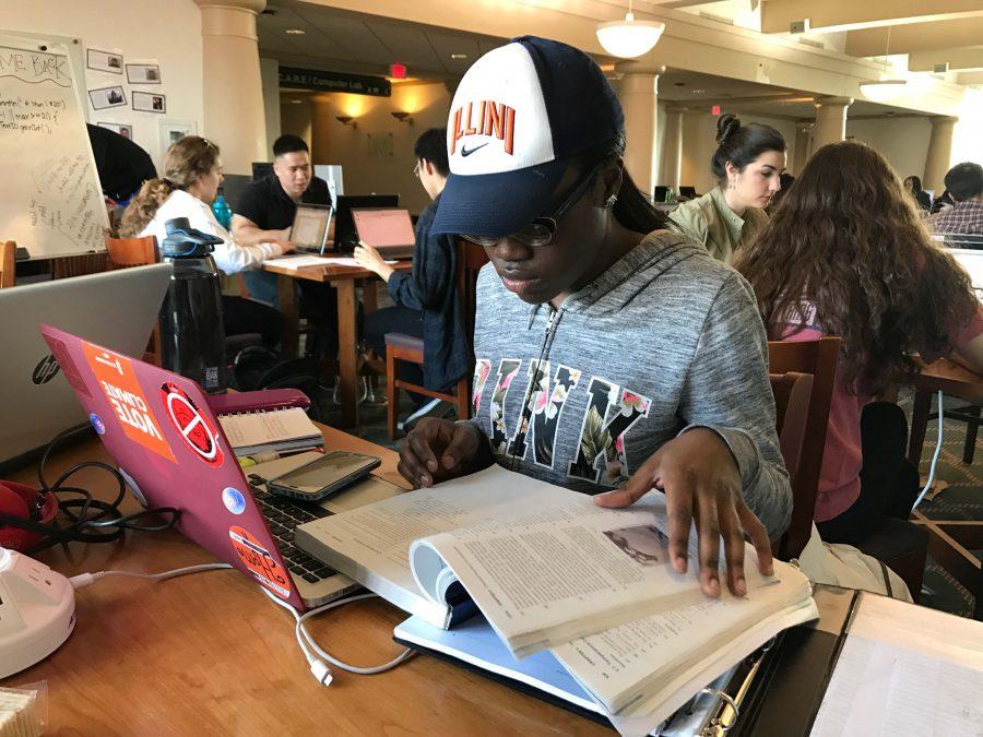 Zainab Oluokun, a freshman in Applied Health Sciences, studies for a chemistry class at Grainger Engineering Library.
