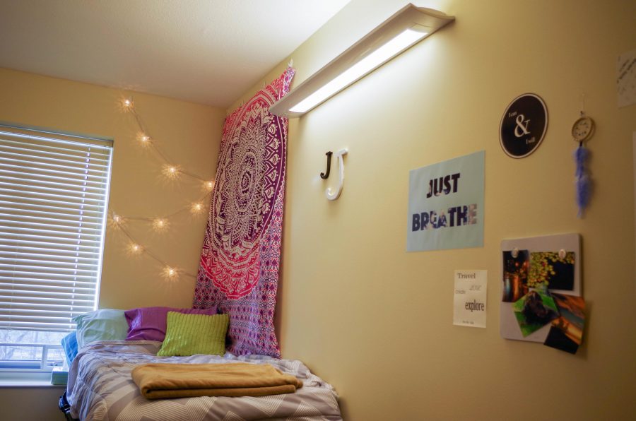 Adding decorations to a bland dorm room can make it both personal and comfortable. 