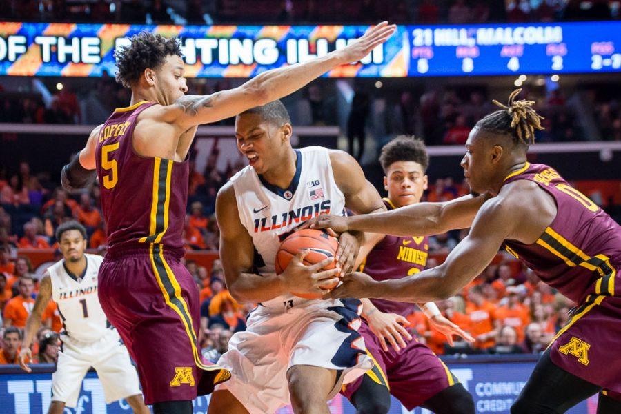 Illinois+Malcolm+Hill+%2821%29+gets+caught+in+traffic+as+he+drives+to+the+basket+during+the+game+against+Minnesota+at+State+Farm+Center+on+Saturday%2C+February+4.+The+Illini+lost+68-59.