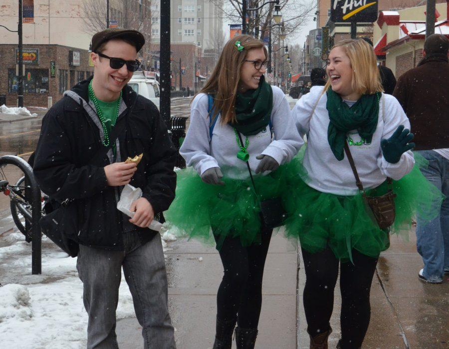 Students walk down Green Street during Unofficial 2013. 