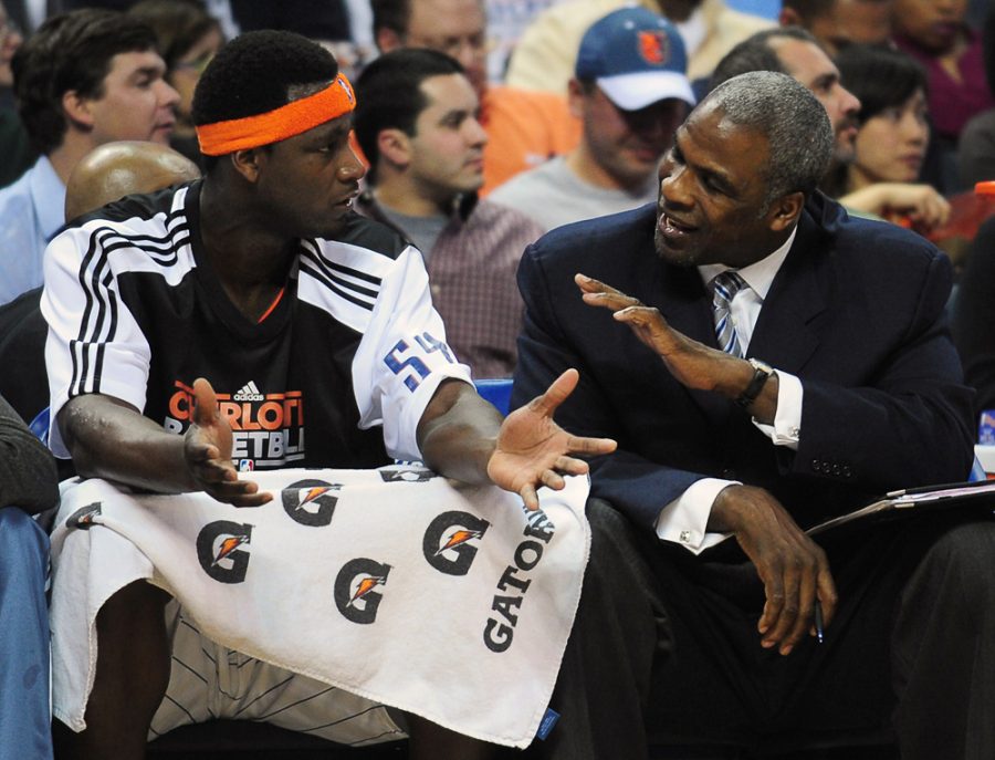 The Charlotte Bobcats' Kwame Brown, left, and assistant coach Charles Oakley talk after Brown was called for a technical foul following a dunk against the Sacramento Kings during first-half action on Friday, February 25, 2011, at Time Warner Cable Arena in Charlotte, North Carolina. 