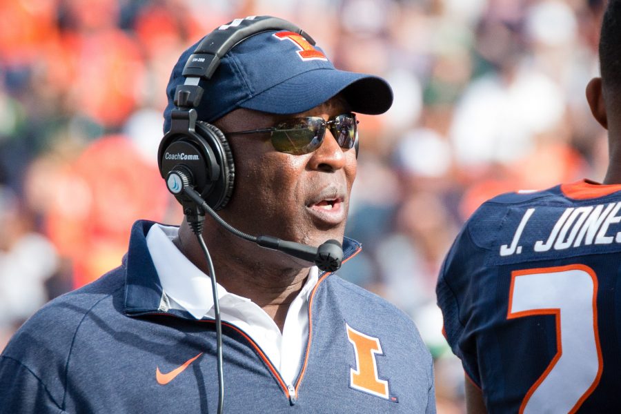 Illinois head coach Lovie Smith talks to his team during a timeout in the game against Michigan State at Memorial Stadium on Saturday, November 5. The Illini won 31-27.