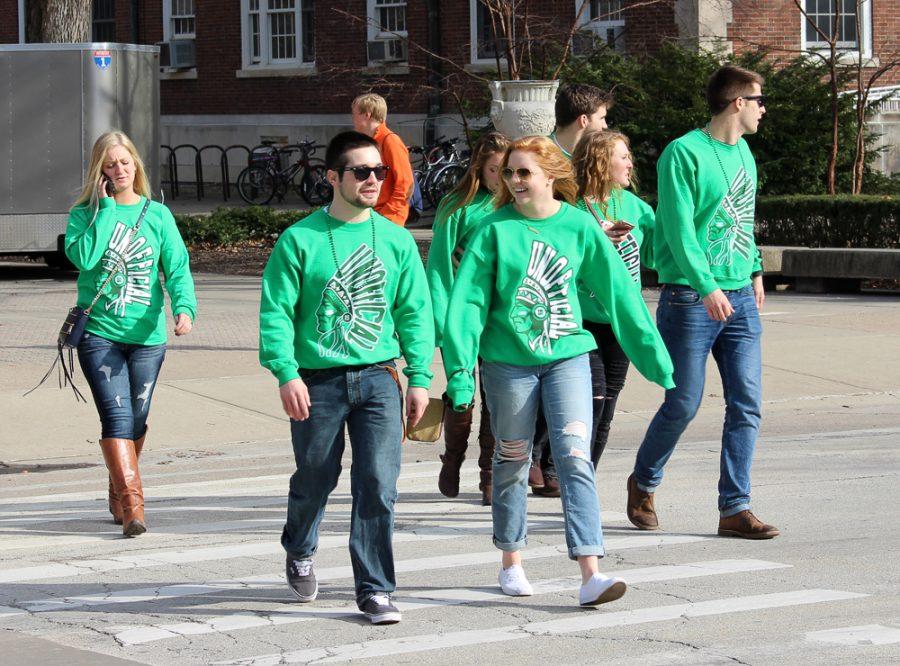 Group of people crossing the street and showing Unofficial pride during Unofficial 2016.
