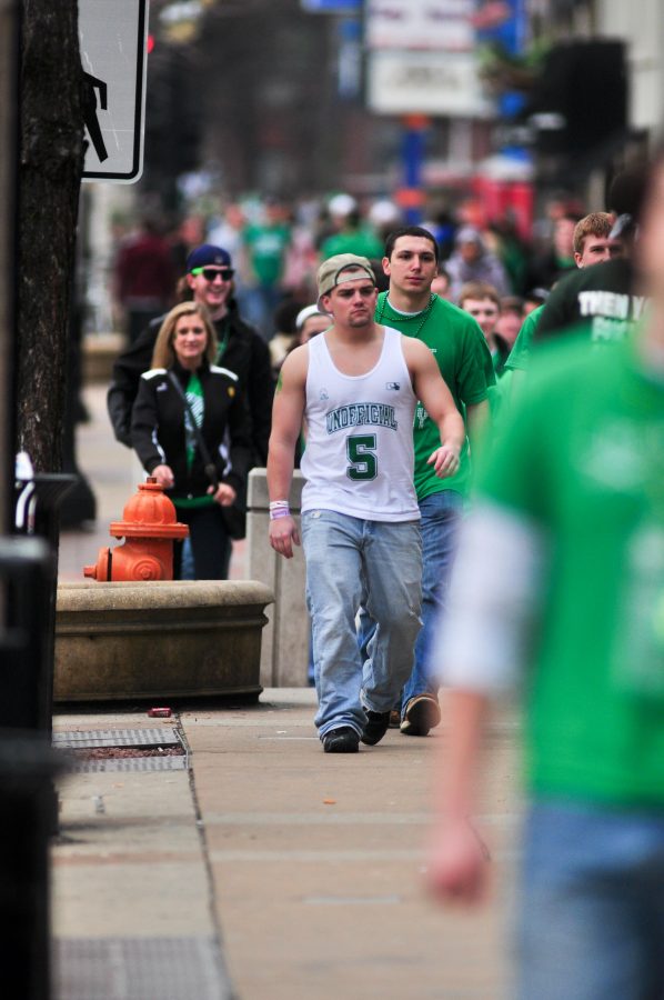Students walk on Green Street during Unofficial on March 2, 2012.