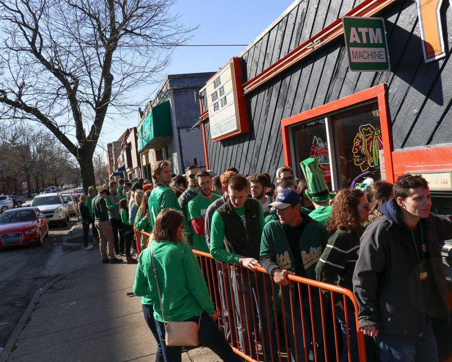 A line for Kams stretches down Daniel St. as people wait to enter and celebrate Unofficial earlier this year. Despite the festivities, the University dropped from No. 3 to No. 14 on the Princeton Reviews list of top party schools. 