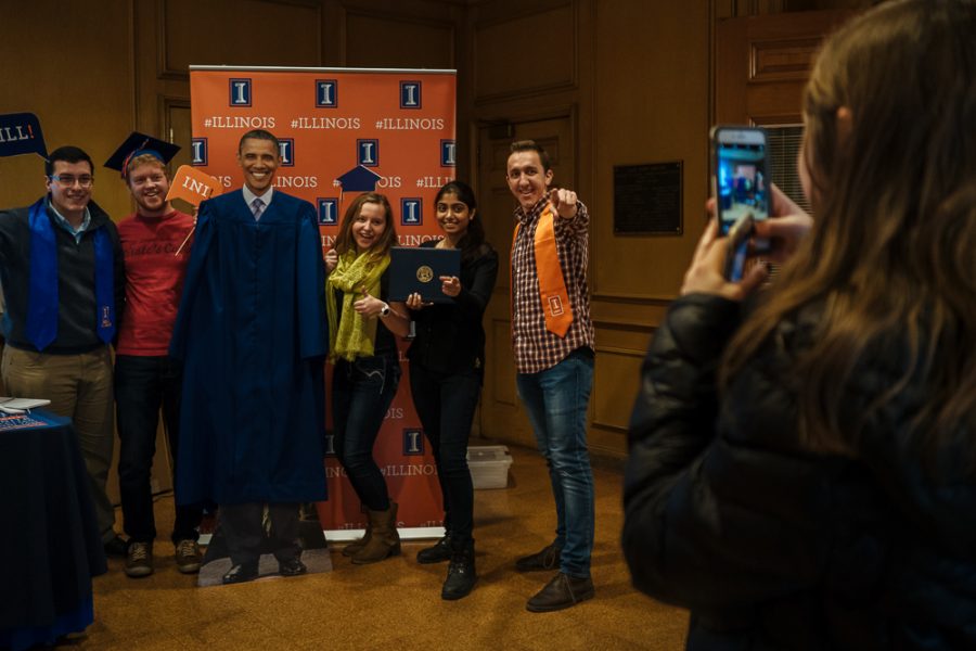 Students pose with an Obama cutout at the letter writing event on Jan. 31 where students wrote letters to persuade the former president to speak at this years commencement.