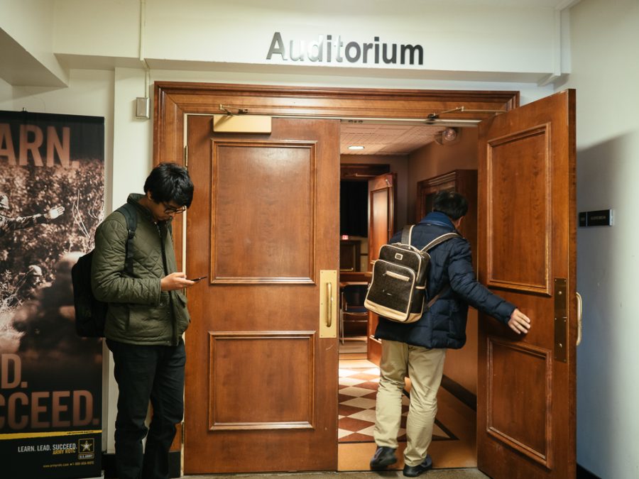 Students walk into the auditorium of the Armory on March 15, 2017.