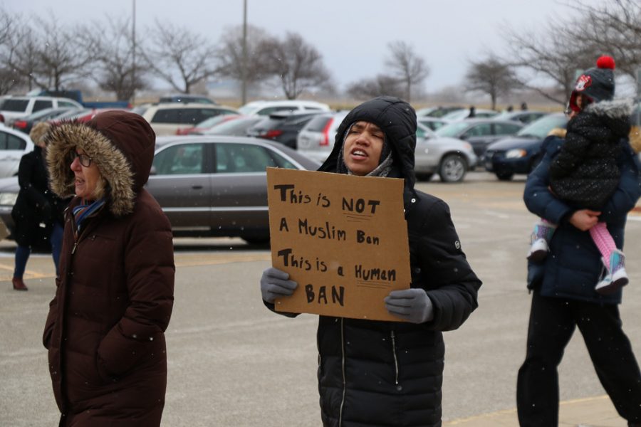 Protestors march in response to President Trump’s first travel ban in front of Willard Airport on Jan. 29. Students without citizenship face detrimental consequences because of the ban.