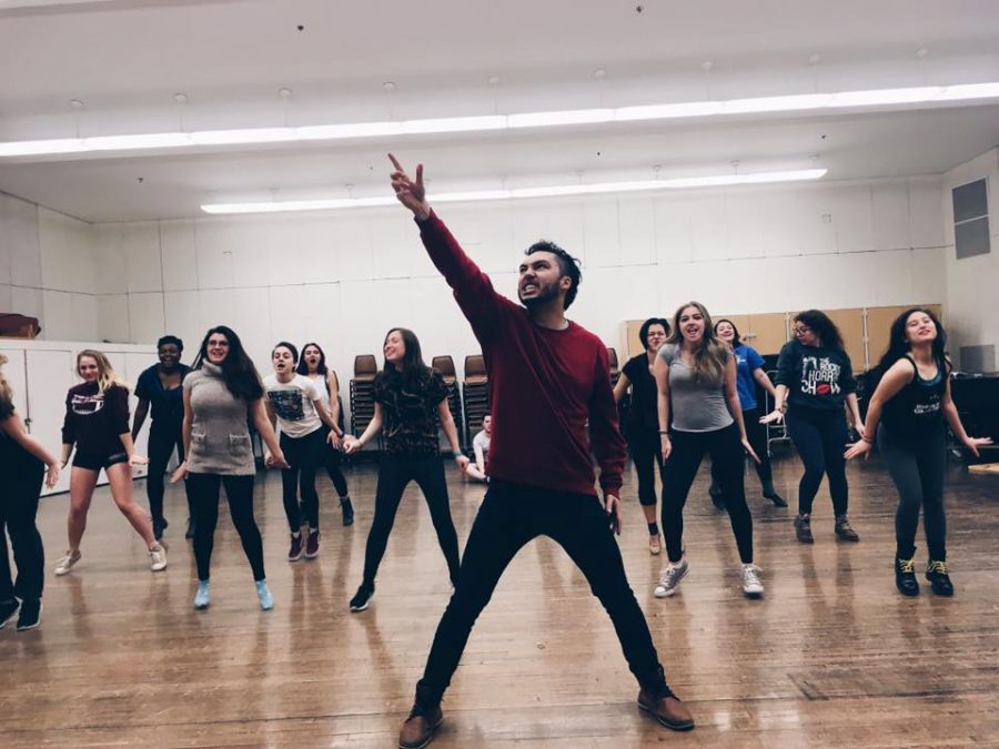 Members of American Idiot rehearse the choreography for Favorite Son in the Orchestra room in the Krannert Center on Feb. 16.