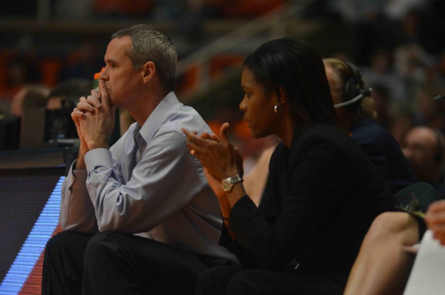LaKale Malone coaches on the sideline during an Illinois womens basketball game in February. 