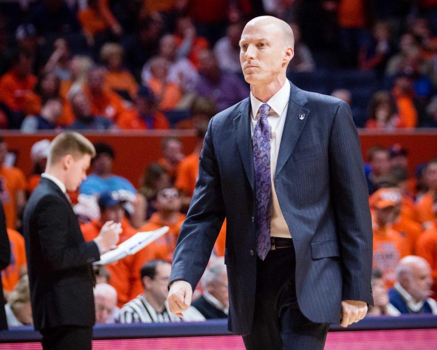 Illlinois head coach John Groce walks back to the bench during a timeout in the game against Wisconsin at State Farm Center on Tuesday, January 31. The Illini lost 57-43.