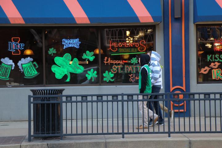 Students walk down Green Street in green to celebrate Unofficial St. Patricks Day.
