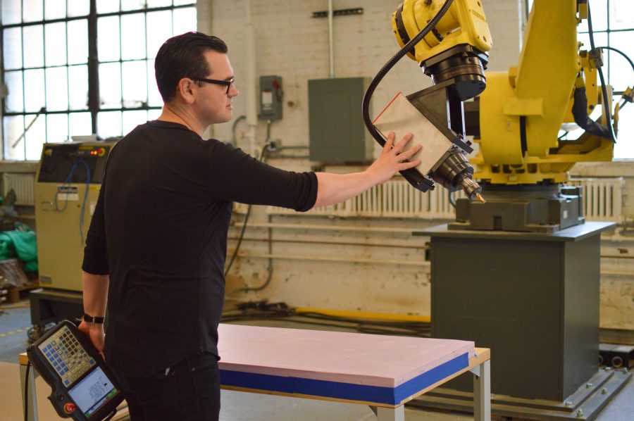 Kevin Erickson, architecture professor at the University, uses the robotic arm. The arm, purchased in 2015, helps students improve their design skills. 