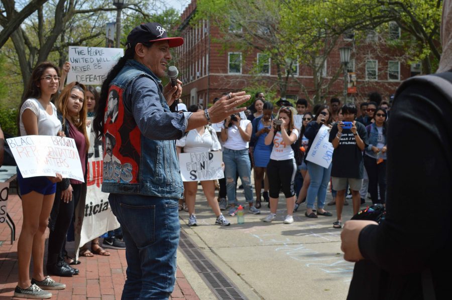 Julio Villegas, who protested in the original 1992 rally, speaks about the updated demands on the Main Quad on Wednesday. Students gathered to protest and voice new concerns, based off of the ones originally made in 1992. 