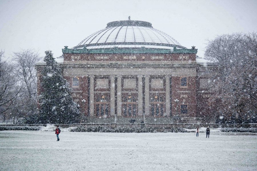 Foellinger Auditorium in the snow on Dec. 4. While living in the Midwest, its important to know what is appropriate to wear during which season, writes brand manager Brooke.