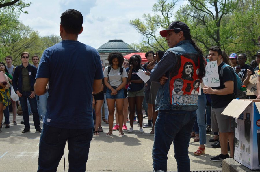 Julio Villegas and Chuy Chavez, an original protester from 1992, speaks at a rally on the Main Quad on Wednesday. Students gathered to protest and voice demands originally made in 1992. Columnist Tatiana Rodriguez hopes the University will listen to protester’s demands. 