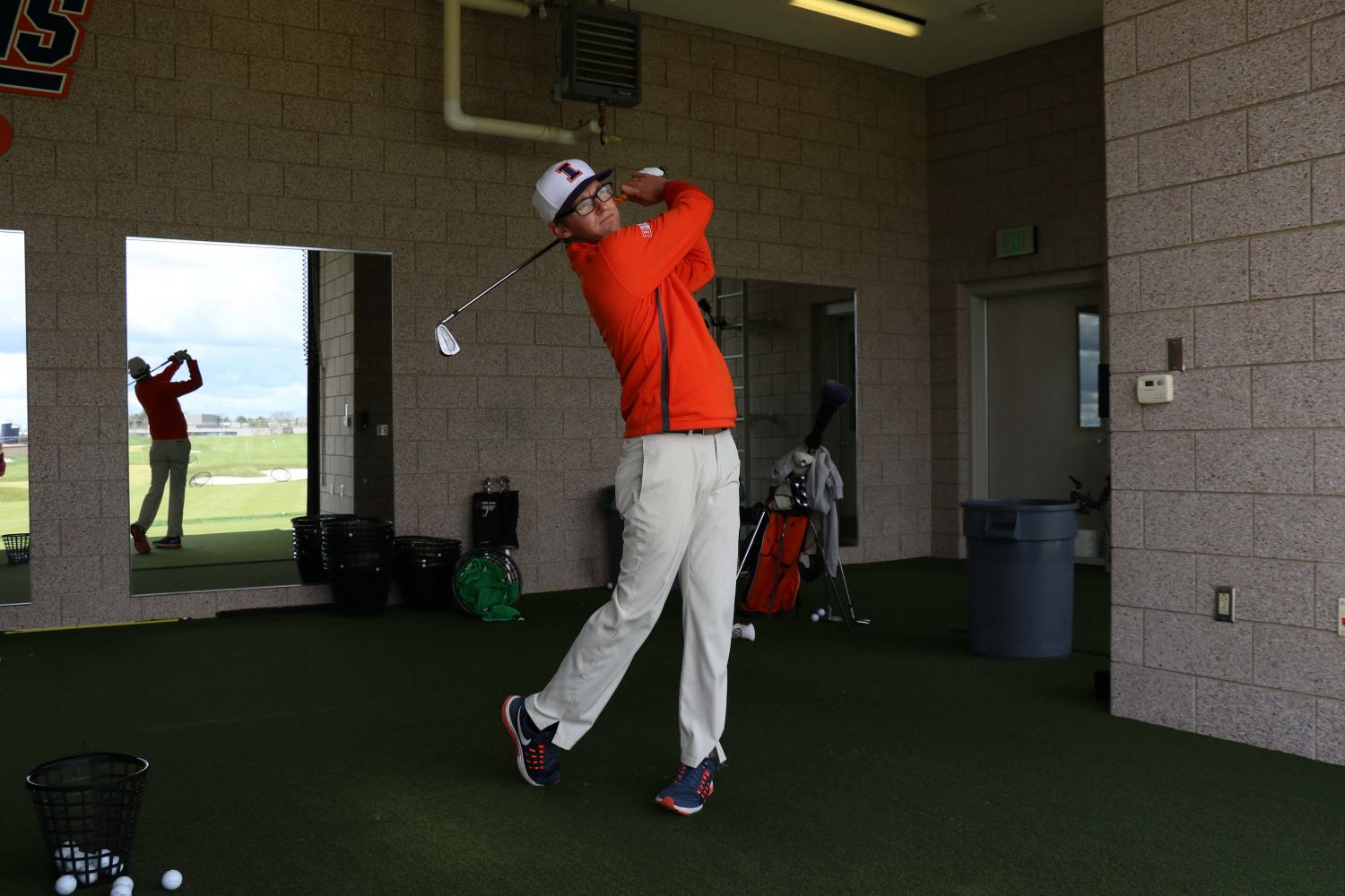 Dylan Meyer takes a practice swing at the Demirjian Golf Practice Facility on April 6. Meyer led the Illini to a Big Ten championship last weekend.