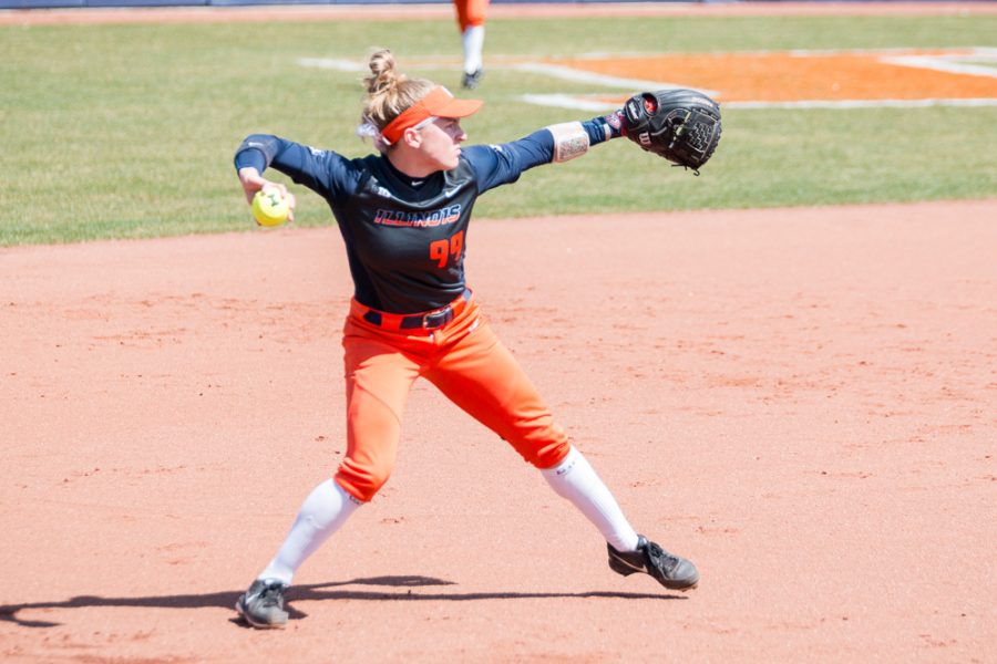 Illinois third baseman Annie Fleming (99) looks to throw the ball to first during the game against Minnesota at Eichelberger Field on Saturday, April 1. The Illini won 4-3.