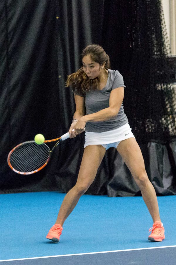 Illinois Louise Kwong hits a backhand against Nebraska at the Atkins Tennis Center on April 3. With a two-match winning streak, Illinois hosts Ohio State and Penn State this weekend.