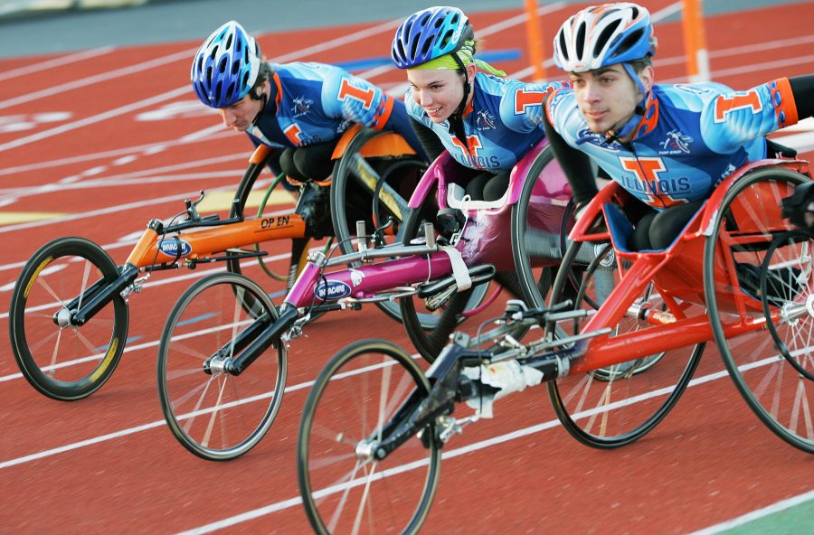 Amanda McGrory, center, who placed second in the womens wheelchair division of the Boston Marathon on Monday, practices at the Illinois Track Stadium on Monday, April 9, 2007, with teammates Cully Mason, right, and Josh George, left, who placed 10th in the marathon.