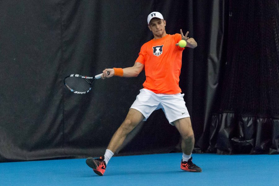 Illinois Aleks Vukic gets ready to return the ball during the match against Wisconsin at the Atkins Tennis Center on Sunday, April 3. 