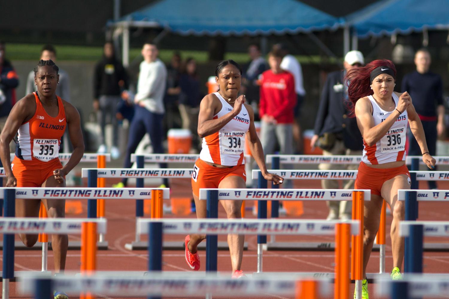 Kortni Smyers-Jones (left), Pedrya Seymour (middle), and Jayla Stewart (right) race down the track in the 100 meter hurdles at the Illinois Twilight at the Illinois Track Field on April 22. Illinois will compete in the NCAA championships this weekend. 