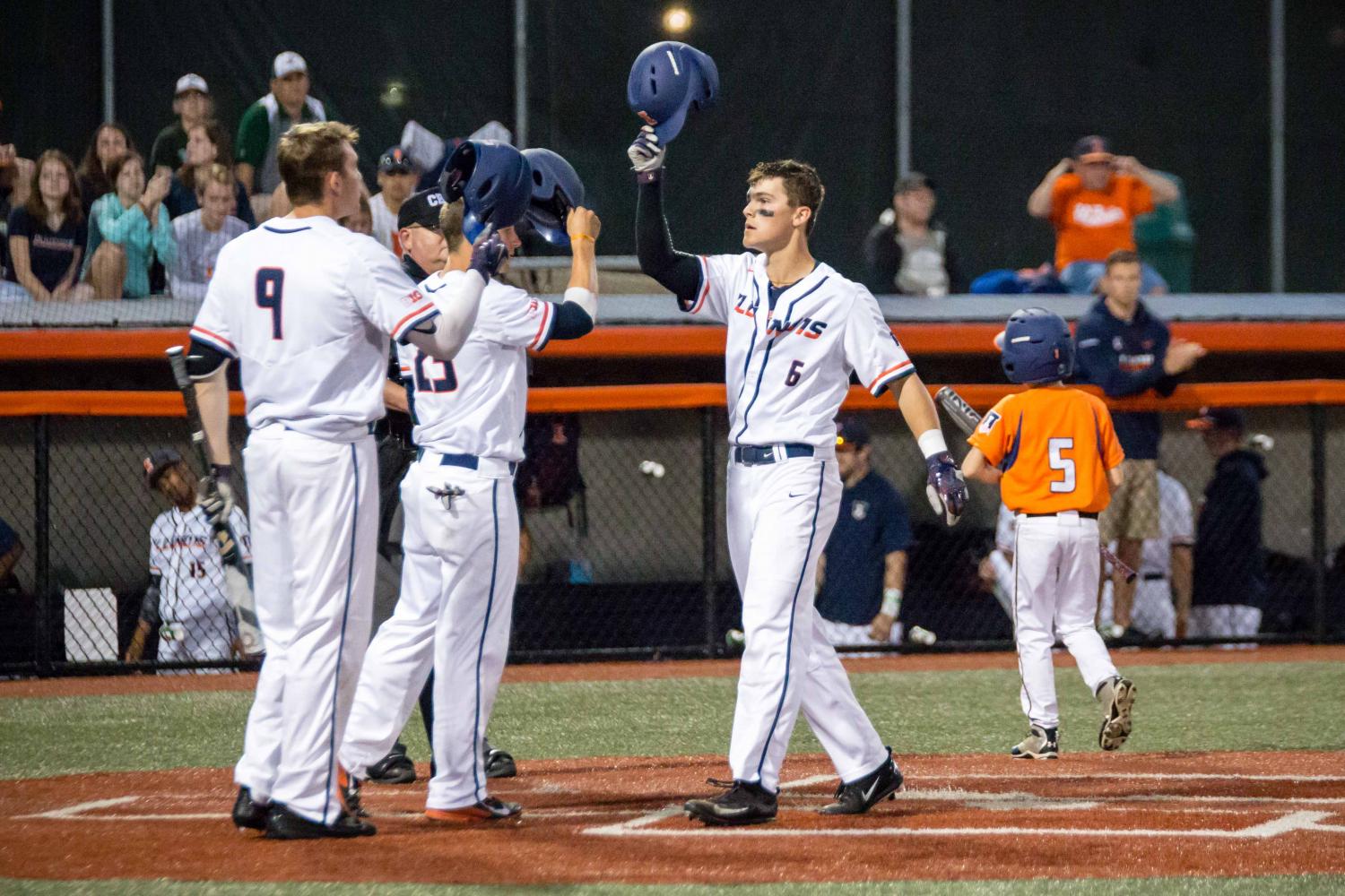 Michael Massey comes into home against Western Michigan at Illinois Field on April 18. 