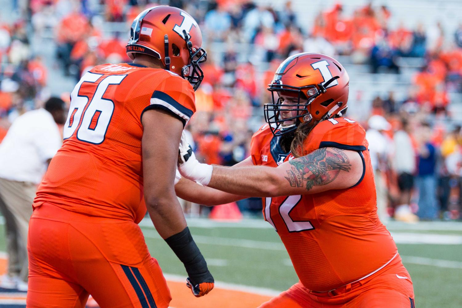 Illinois offensive lineman Gabe Megginson warms up before the game against North Carolina at Memorial Stadium on Spt. 10. Megginson eats an extra peanut butter sandwich and protein shake before bed to maintain his goal weight. 