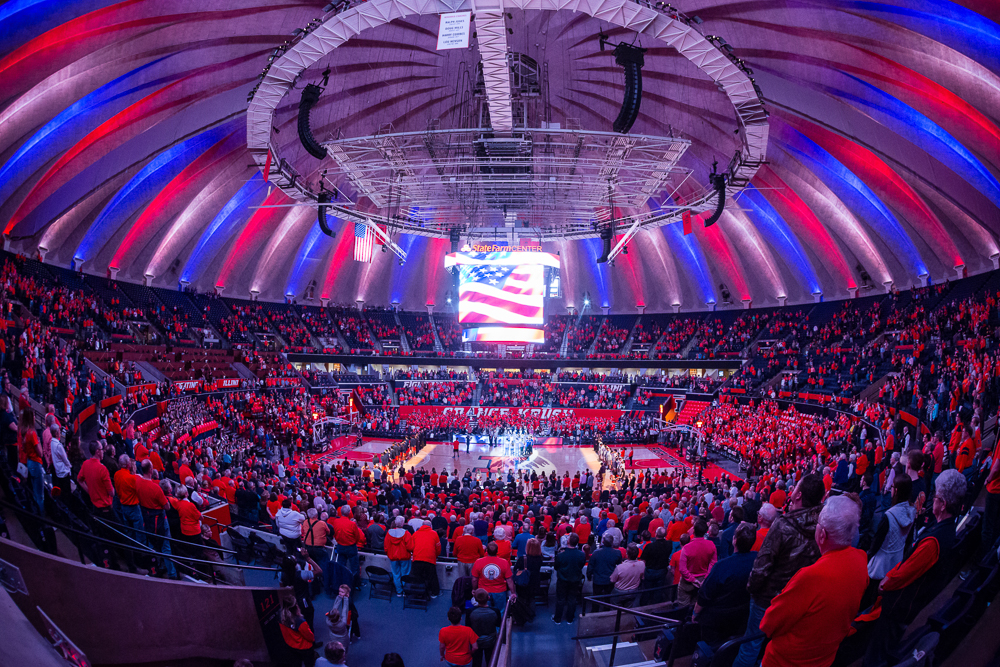 Red, white and blue lights illuminate State Farm Center during the national anthem before the game against Northwestern at State Farm Center on Tuesday, February 21.