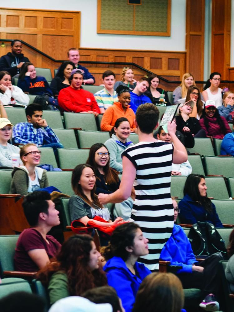 Professor Lena Hann hands out an entertaining prize as her students burst into laughter during her last lecture at Illinois on May 3.