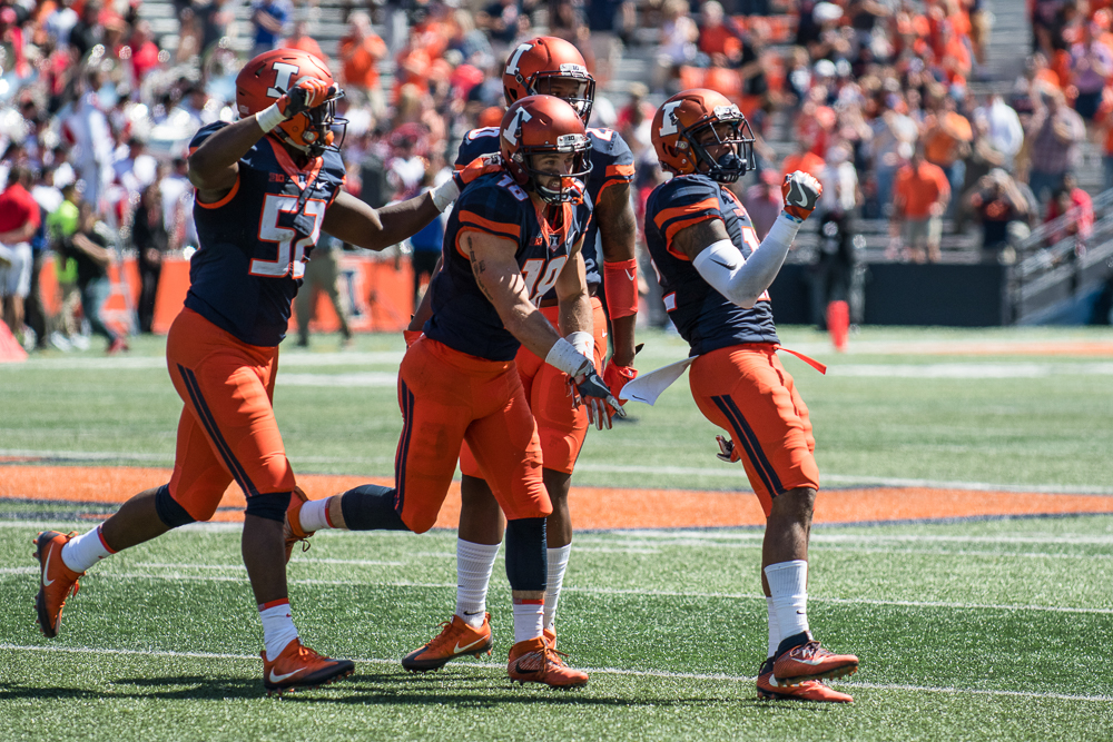 Illinois wide receiver Mike Dudek celebrates a punt return during the game against Ball State on Saturday, September 2, at Memorial Stadium.