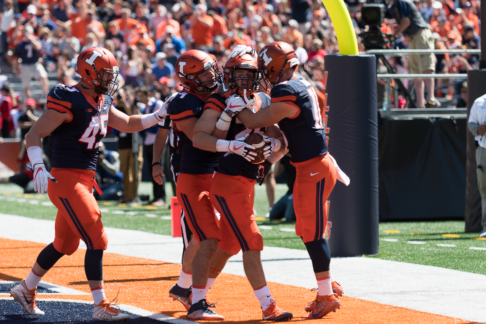 Freshman running back Mike Epstein celebrates with his teammates after scoring his first touchdown in Illinois 24-21 win over Ball State on September 2.