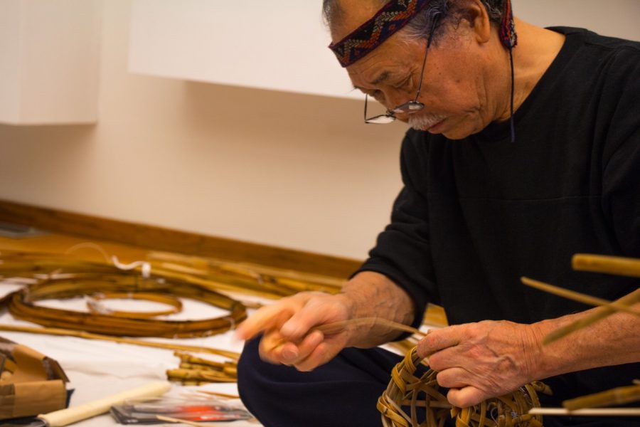 Noboru Fujinuma, a renowned contemporary basket artist, creates a chabana container used for flowers during a tea ceremony at the Japan House on Oct. 24. Fujinuma is a Living National Treasure of Japan, meaning he is certified as a preserver of important, intangible, cultural properties.