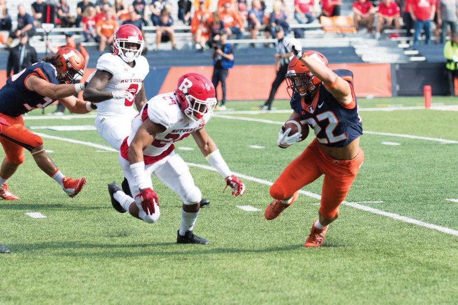 Illinois running back Kendrick Foster dodges defenders during the game against Rutgers on Oct. 24. Although Illinois lost to Wisconsin 35-24, Kendrick Foster intends to make the most of his last season as an Illini football player and take advantage of every opportunity. 