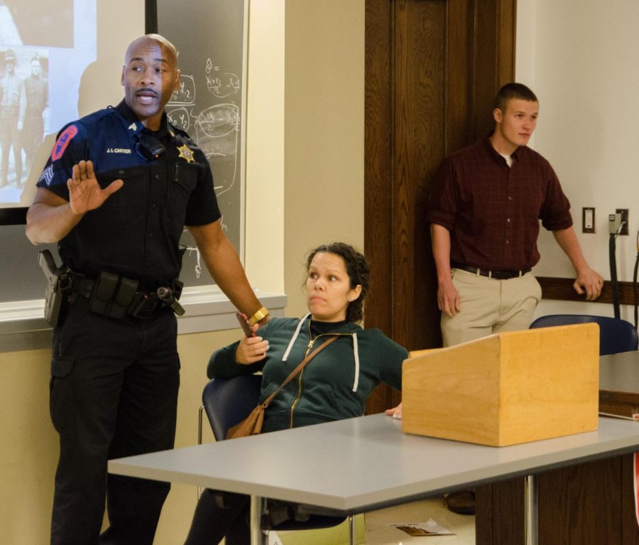 The Illini Republicans host Meeting with the Chief , in Lincoln Hall on Thursday, Oct. 26. Police Sergeant James Carter of the UIPD and two other officers took control of the meeting after Angela King entered the room and began destroying posters depicting Chief Illiniwek.
