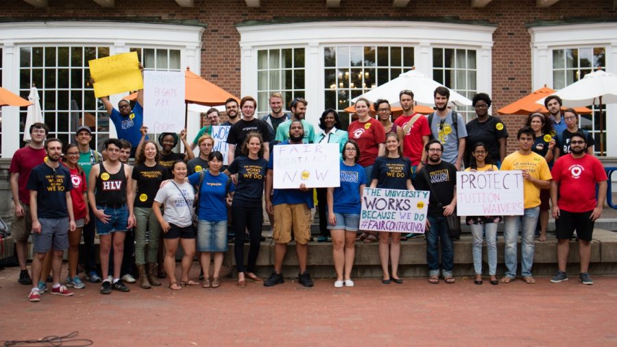 Graduate Employees Organization rally after their contract with Illinois administration expired on Aug. 16 outside the Illini Union.