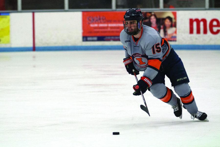 Eric Cruickshank (15) gains possession of the puck and takes it up the ice to Robert Morris zone at the Ice Arena on Saturday, Feb. 18. Illini fell to Robert Morris 3-2.