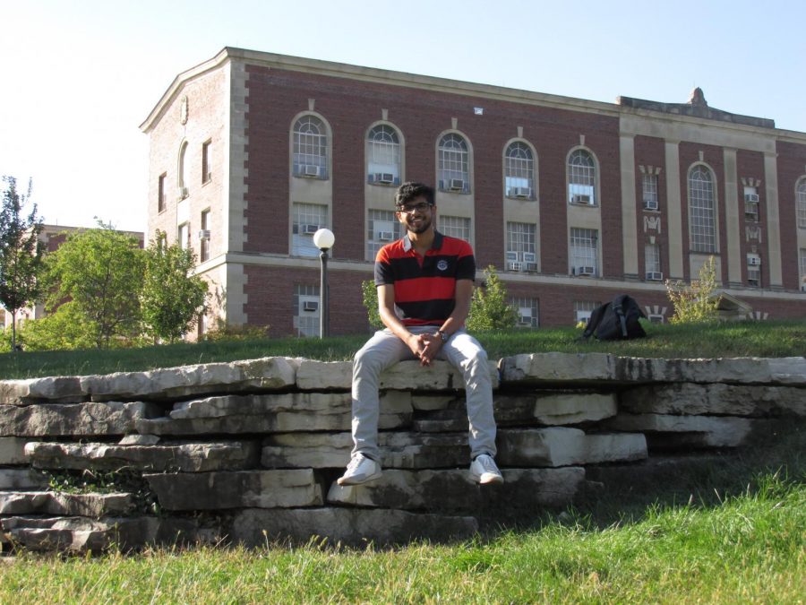 Ankith Subramanya, one of the creators of the app Small World, relaxes on the Engineering Quad after class. Subramanya and his team created an app that allows people to plan out vacations. 
