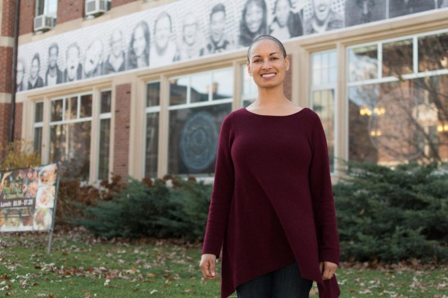 Rebecca Ginsburg works with the Education Justice Project located at the YMCA. Here, she poses in front of the University YMCA.