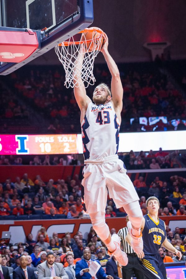Illinois forward Michael Finke rises up for a slam dunk during the game against Augustana at State Farm Center on Wednesday, Nov. 22, 2017.