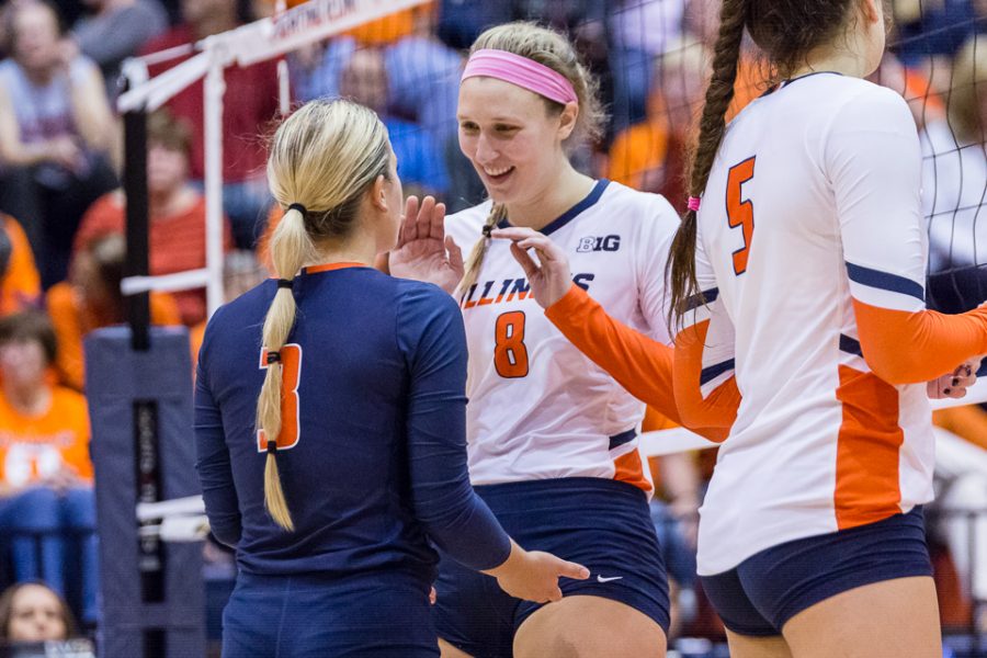 Illinois+outside+hitter+Beth+Prince+%288%29+smiles+at+defensive+specialist+Brandi+Donnelly+%283%29+before+the+fourth+set+in+the+match+against+Michigan+at+Huff+Hall+on+Saturday%2C+Nov.+5%2C+2017.+The+Illini+won+3-2.