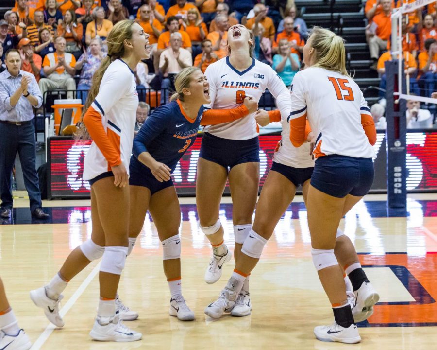 Illinois defensive specialist Brandi Donnelly (3) and her team celebrate during the match against Stanford at Huff Hall on Friday, September 8. The Illini lost 3-0.