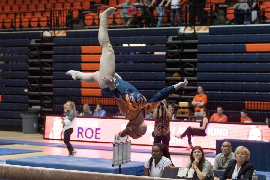 Haylee Roe competes on the beam against Michigan State in Huff Hall on Feb. 17. The men’s and women’s teams competed against each other at Huff Hall on Saturday.