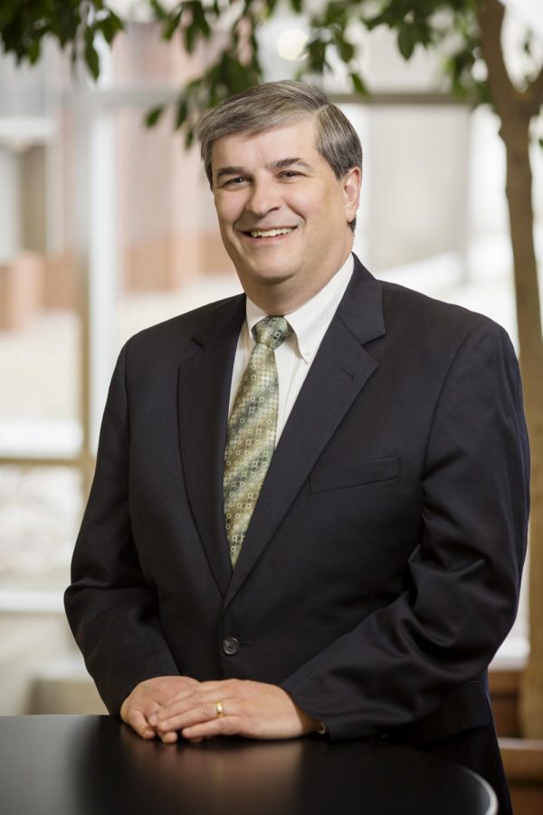 University professor Robert Lawless poses for a portrait. He, among other University faculty and a student, researched bankruptcy misconceptions among minorities. 
