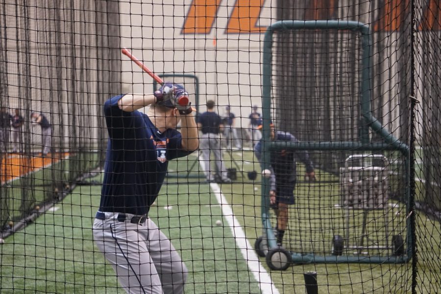 Junior outfielder Doran Turchin takes a swing during batting practice on Jan. 26. Turchin started 48 games for the Illini last season, batting .275 with eight home runs.