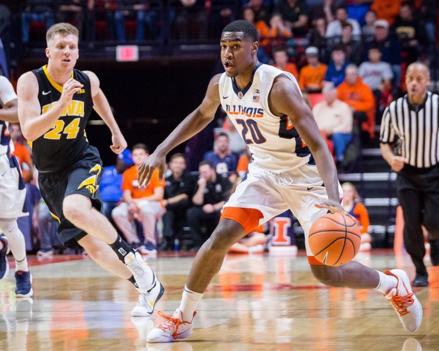 Illinois guard Da'Monte Williams (20) dribbles the ball during the game against Iowa at State Farm Center on Thursday, Jan. 11, 2018. The Illini lost in overtime 104-97.